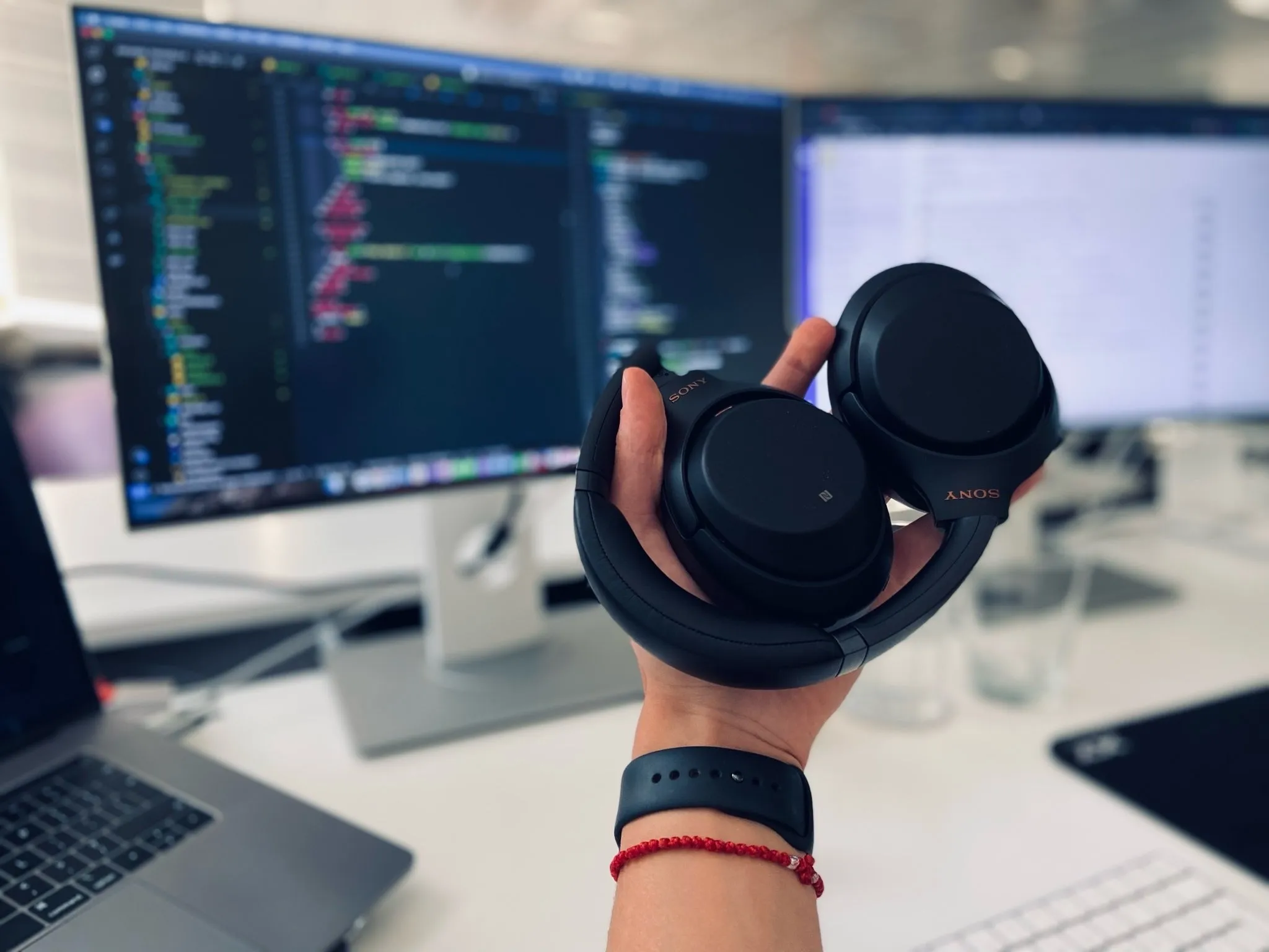 Developer focused coding with headphones